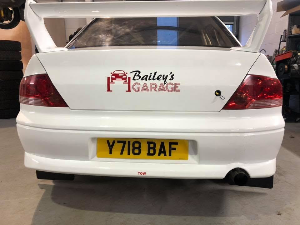 Rear of the Bailey's Garage liveried rally car
